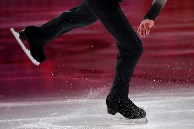 Olympic skating coach under investigation still able to coach at top level