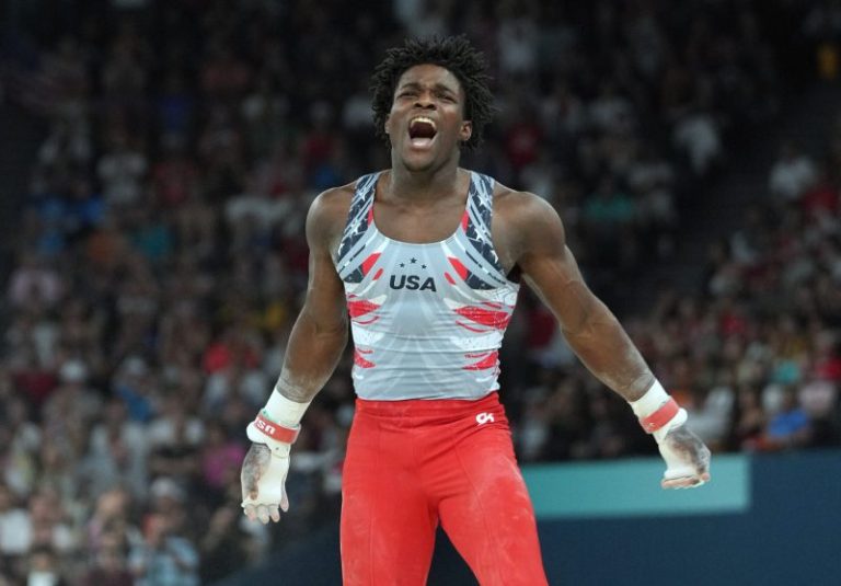Frederick Richard celebrates team bronze in men’s gymnastics