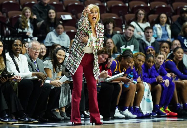 LSU’s Kim Mulkey wears basketball hoop courtside